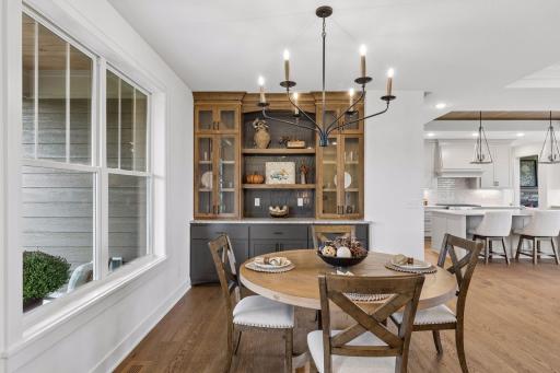 Front informal dining room with stylish built in buffet