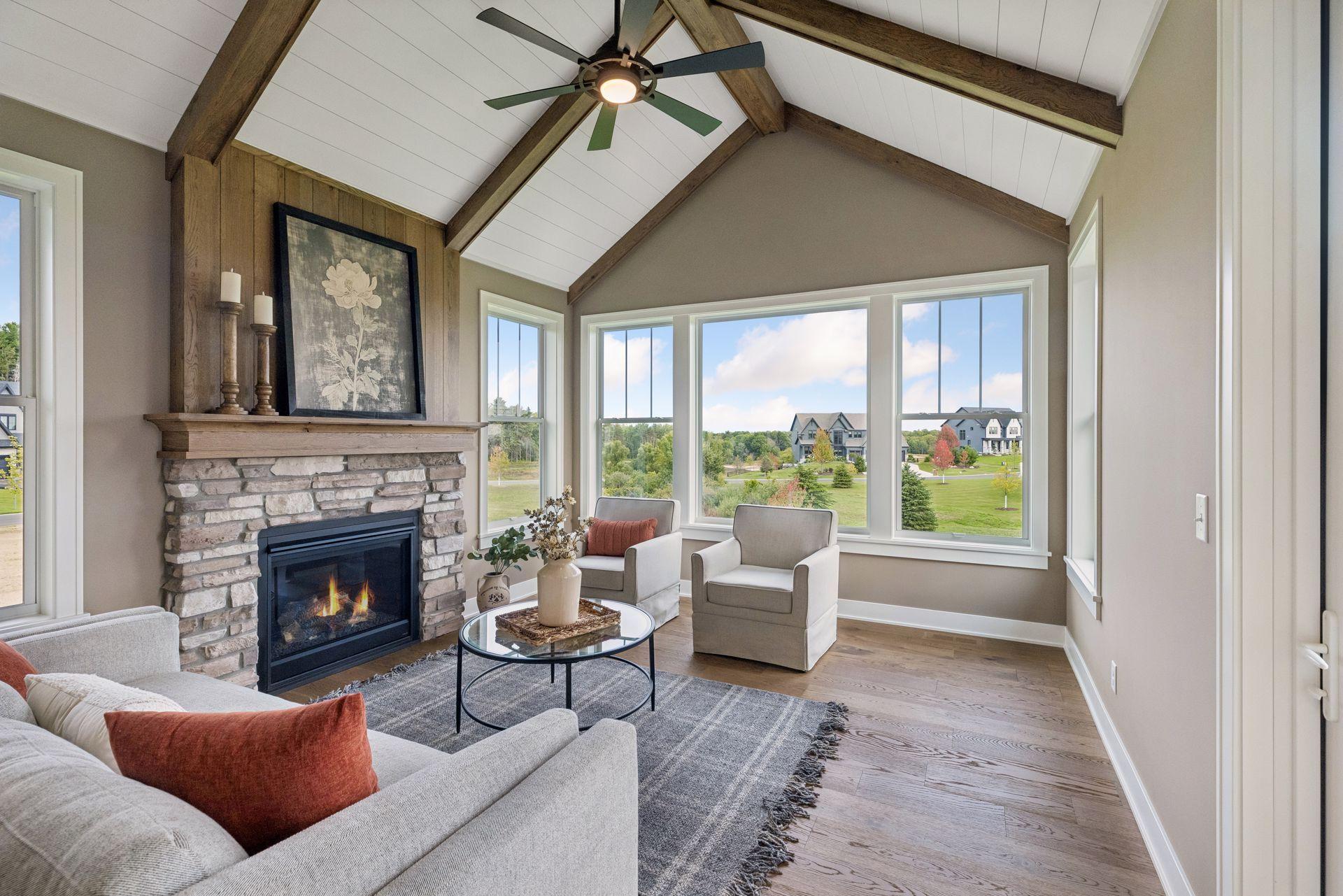 Enjoy the natural views and the cozy fireplace in the sunroom