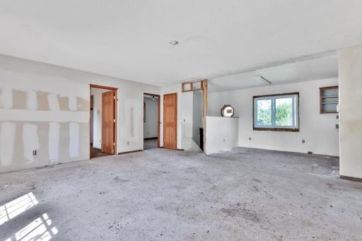 Foyer in Center to entry, Bedroom doors to the left. Formal dining area to rear right.