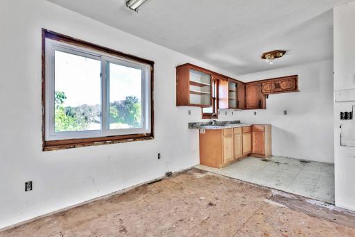 Interior of the dining and kitchen area showing the work ahead of you.