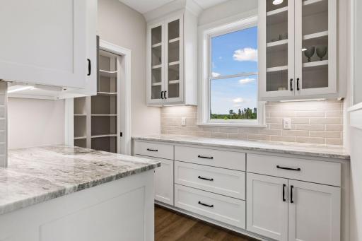Butler's pantry leads to the walk-in pantry