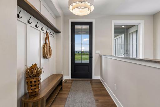 Hang up your coat and enter into this stunning home