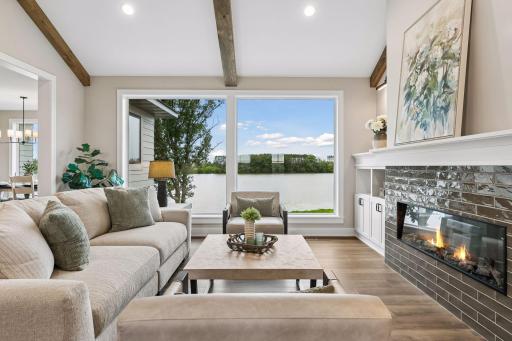 Large picture windows soak in the natural light and lake views