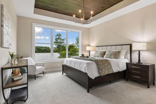 Primary bedroom with stunning tray ceiling