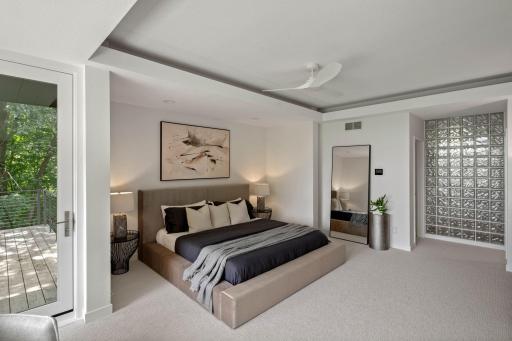 Primary Bedroom to large bath and walk-in closet.