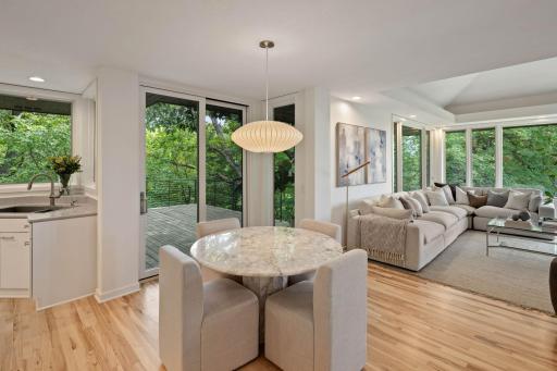Informal Dining off kitchen and hearth room. Access to large deck with treehouse view and new cable railing.