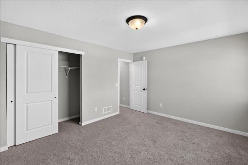 PHOTO OF A DIFFERENT HOME WITH SIMILAR PLAN AND FINISHES. Bedroom 3.