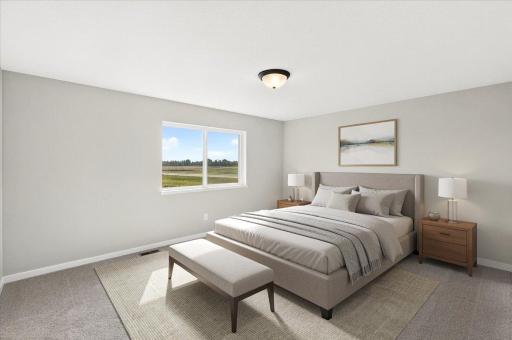 PHOTO OF A DIFFERENT HOME WITH SIMILAR PLAN AND FINISHES VIRTUALLY STAGED. Primary Suite.