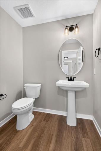 PHOTO OF A DIFFERENT HOME WITH SIMILAR PLAN AND FINISHES.