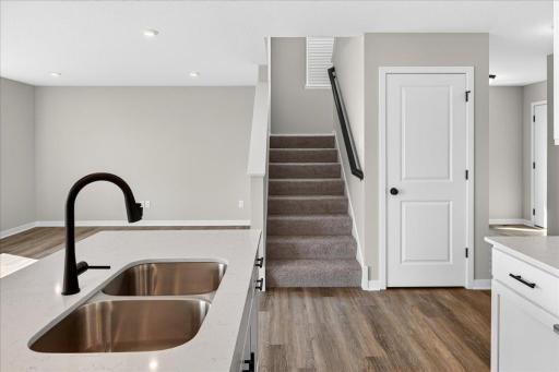PHOTO OF A DIFFERENT HOME WITH SIMILAR PLAN AND FINISHES.
