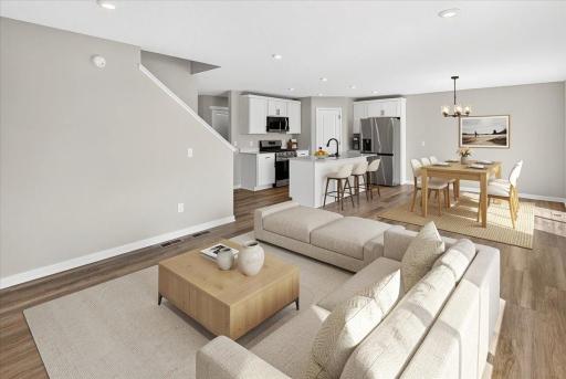 PHOTO OF A DIFFERENT HOME WITH SIMILAR PLAN AND FINISHES VIRTUALLY STAGED.