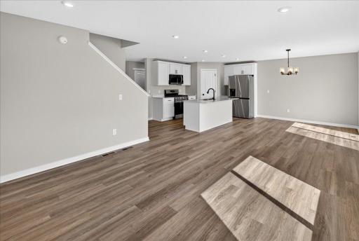 PHOTO OF A DIFFERENT HOME WITH SIMILAR PLAN AND FINISHES.