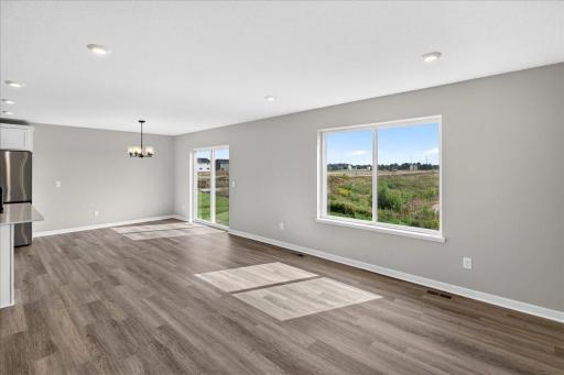 PHOTO OF A DIFFERENT HOME WITH SIMILAR PLAN AND FINISHES.
