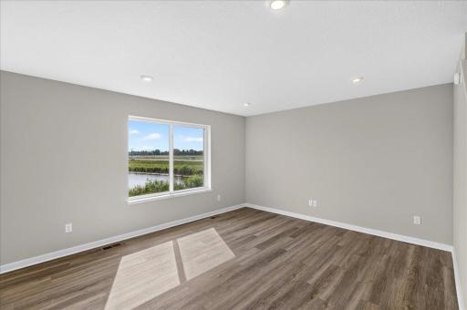 PHOTO OF A DIFFERENT HOME WITH SIMILAR PLAN AND FINISHES.