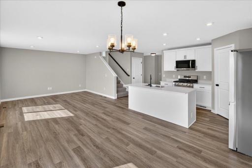 PHOTO OF A DIFFERENT HOME WITH SIMILAR PLAN AND FINISHES.