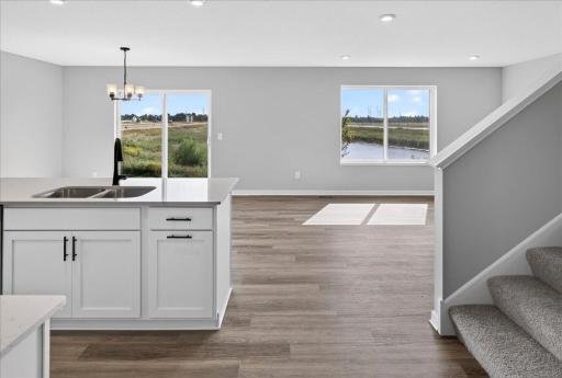 PHOTO OF A DIFFERENT HOME WITH SIMILAR PLAN AND FINISHES.