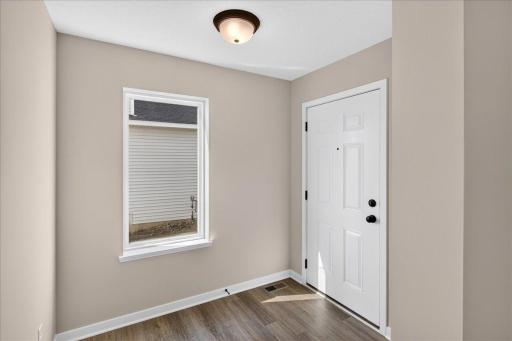 PHOTO OF A DIFFERENT HOME WITH SIMILAR PLAN AND FINISHES.