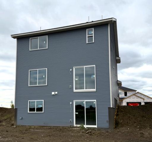 3050 Jandura Ave NE- Rear elevation features a Walkout Lower Level! Sod and Irrigation System included.