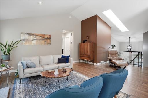 Living room with vaulted ceilings and beautiful hardwood floors