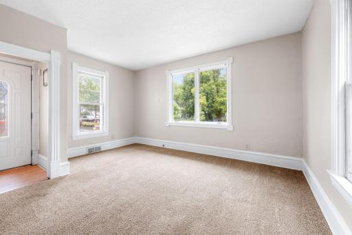 Large windows flood the room with natural light.