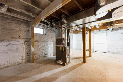 In the basement, headers and support posts have been added, along with concrete on the floor.