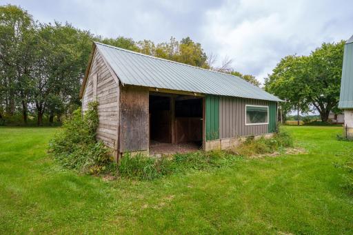 The farm's outbuildings show their age, but don't let appearances fool you - there is potential here to restore, repurpose, and bring new life to these structures.