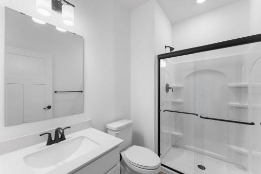 Conveniently placed near main level bedroom, this bathroom is conveniently trucked away with privacy in mind.