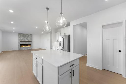 The kitchen has ease-of-access to the mudroom and flows seamlessly into the dining room