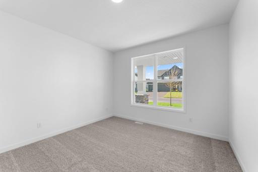 Perfect for a guest suite, office space, or recreation room, this main level secondary bedroom is well-suited for the unique needs of any homeowner.