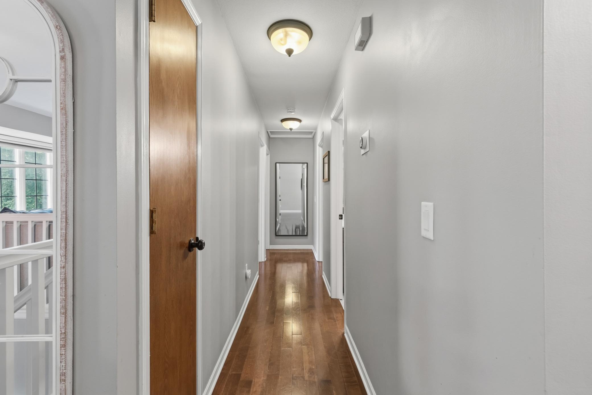 Hallway to the 3 bedrooms and full walk-through bathroom