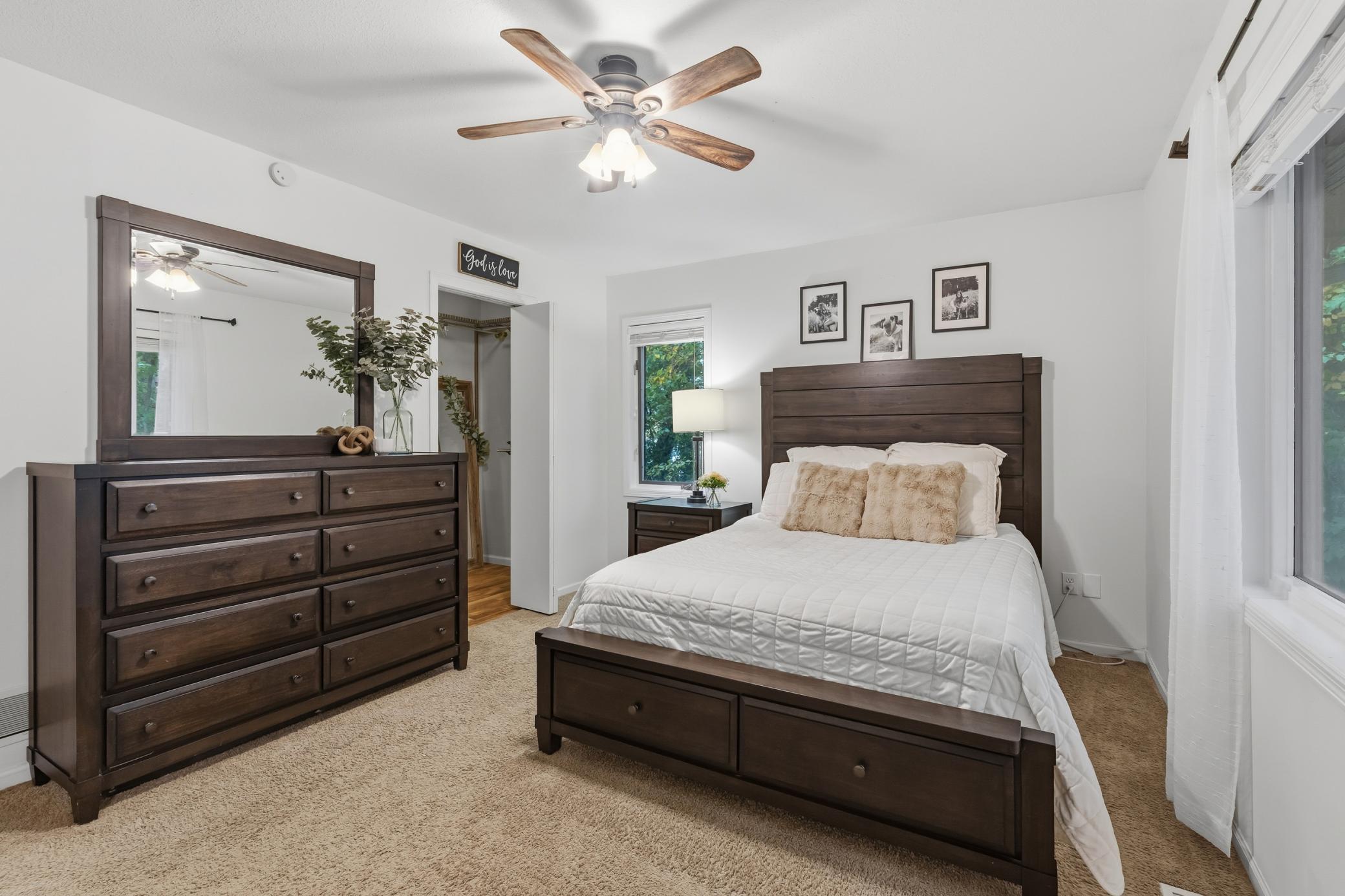 Master Bedroom features ceiling fan and walk-in closet with organizer