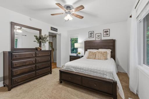 Master Bedroom features ceiling fan and walk-in closet with organizer