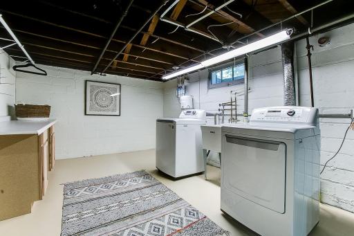 Basement laundry areaâ virtually staged