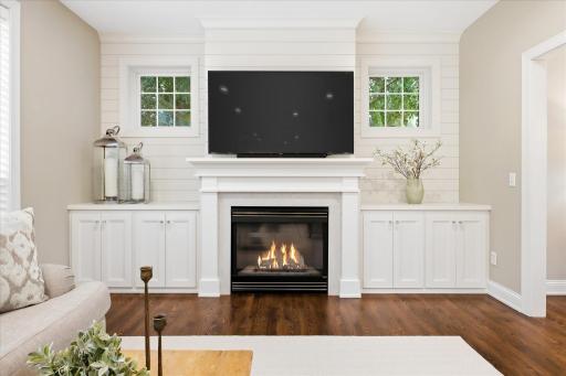Beautiful fireplace with custom built-ins & added windows for even more natural light