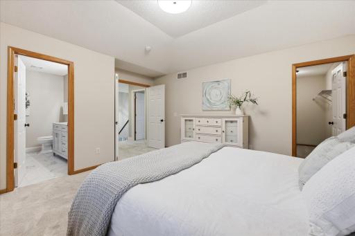 Private primary suite with walk-in closet & beautifully renovated bath