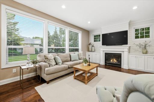 Light-filled living room with walls of windows
