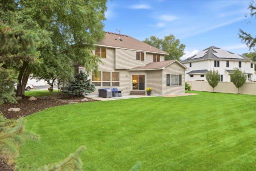Large, level backyard with patio perfect for entertaining or relaxing outdoors