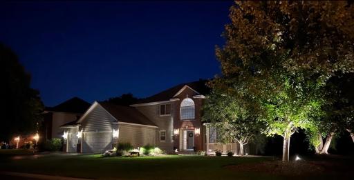 Thoughtful landscape lighting makes this home shine and adds the perfect evening ambiance