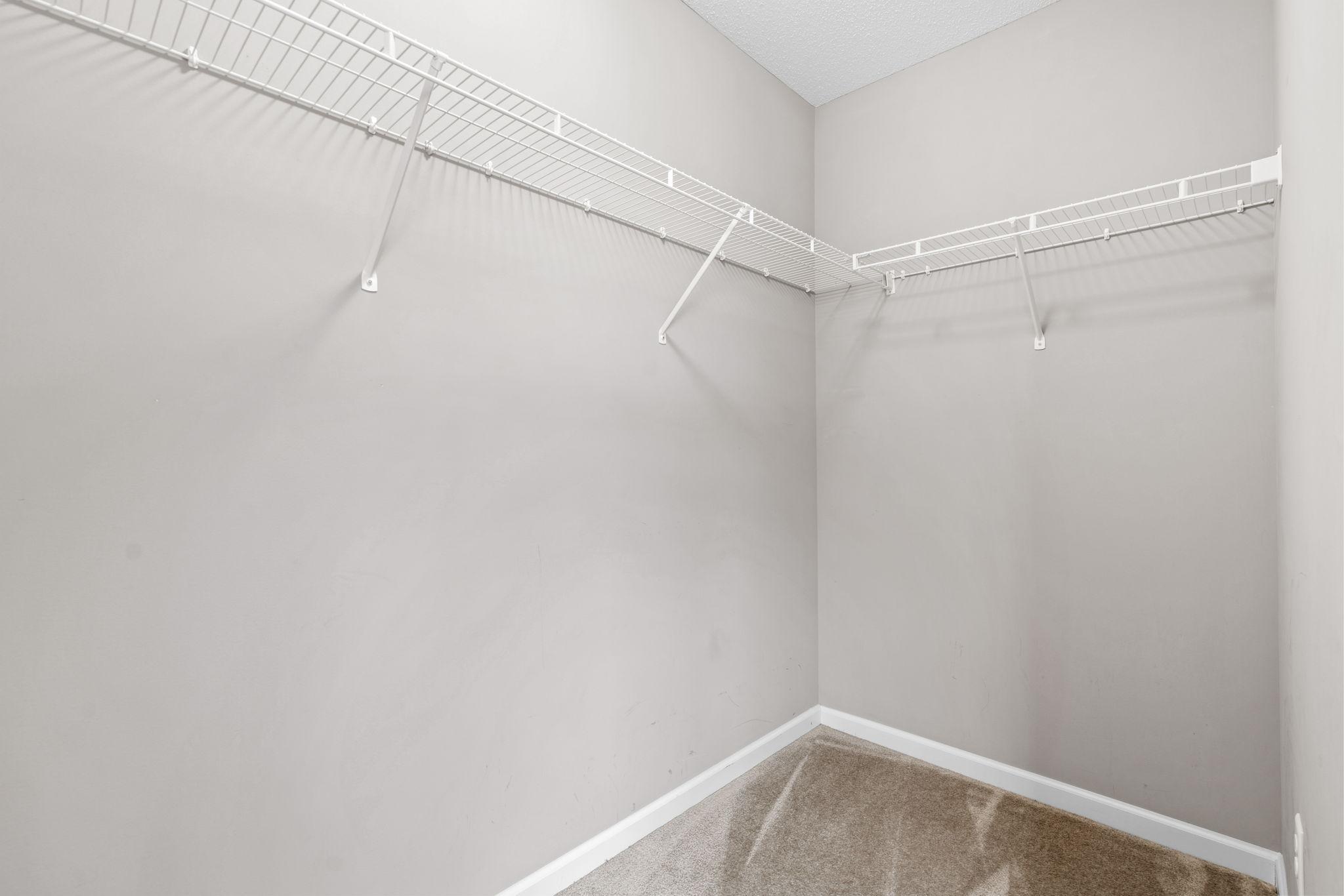 The first walk in closet is larger than the 2nd