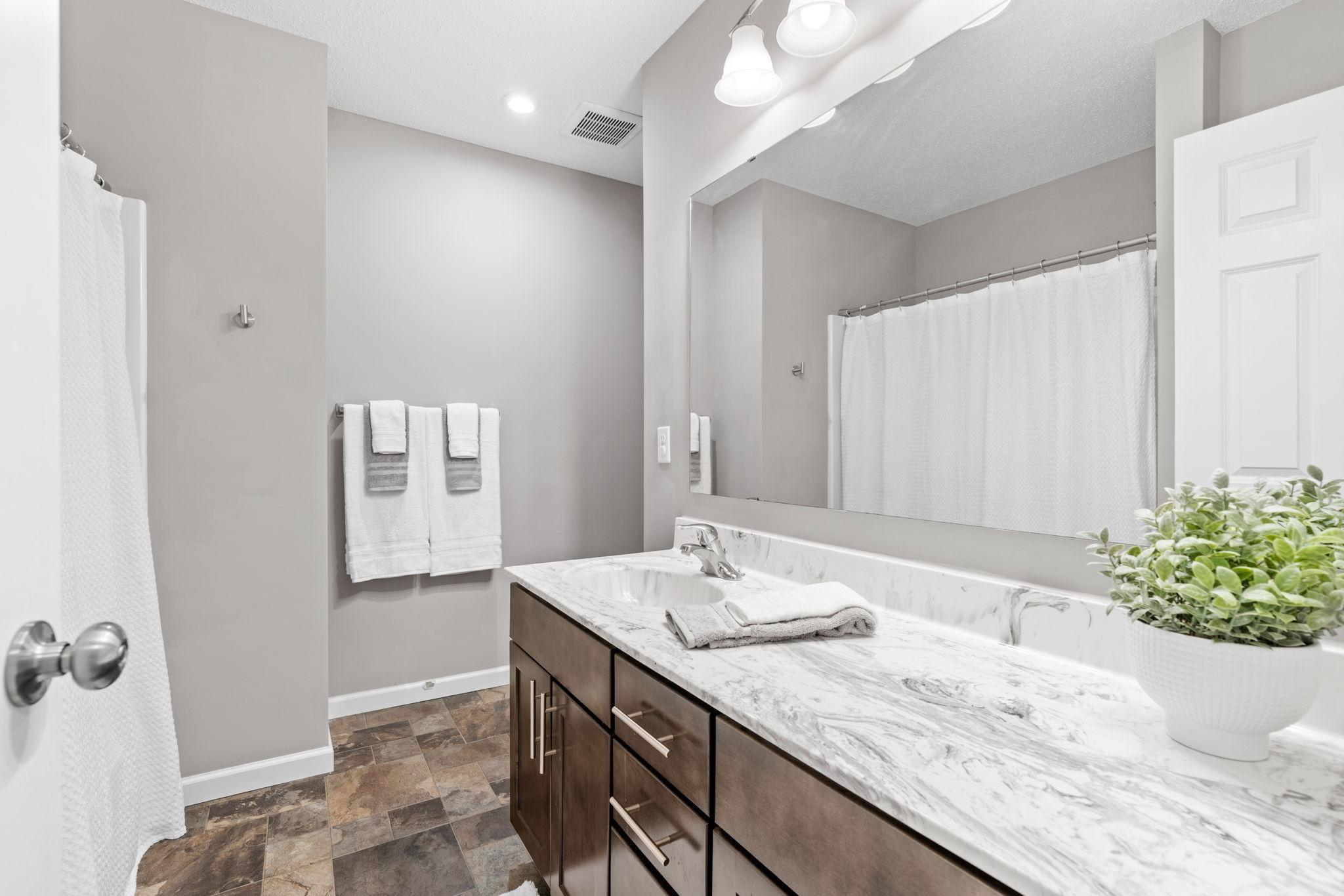 The hall bath comes with a shower & bath combo
