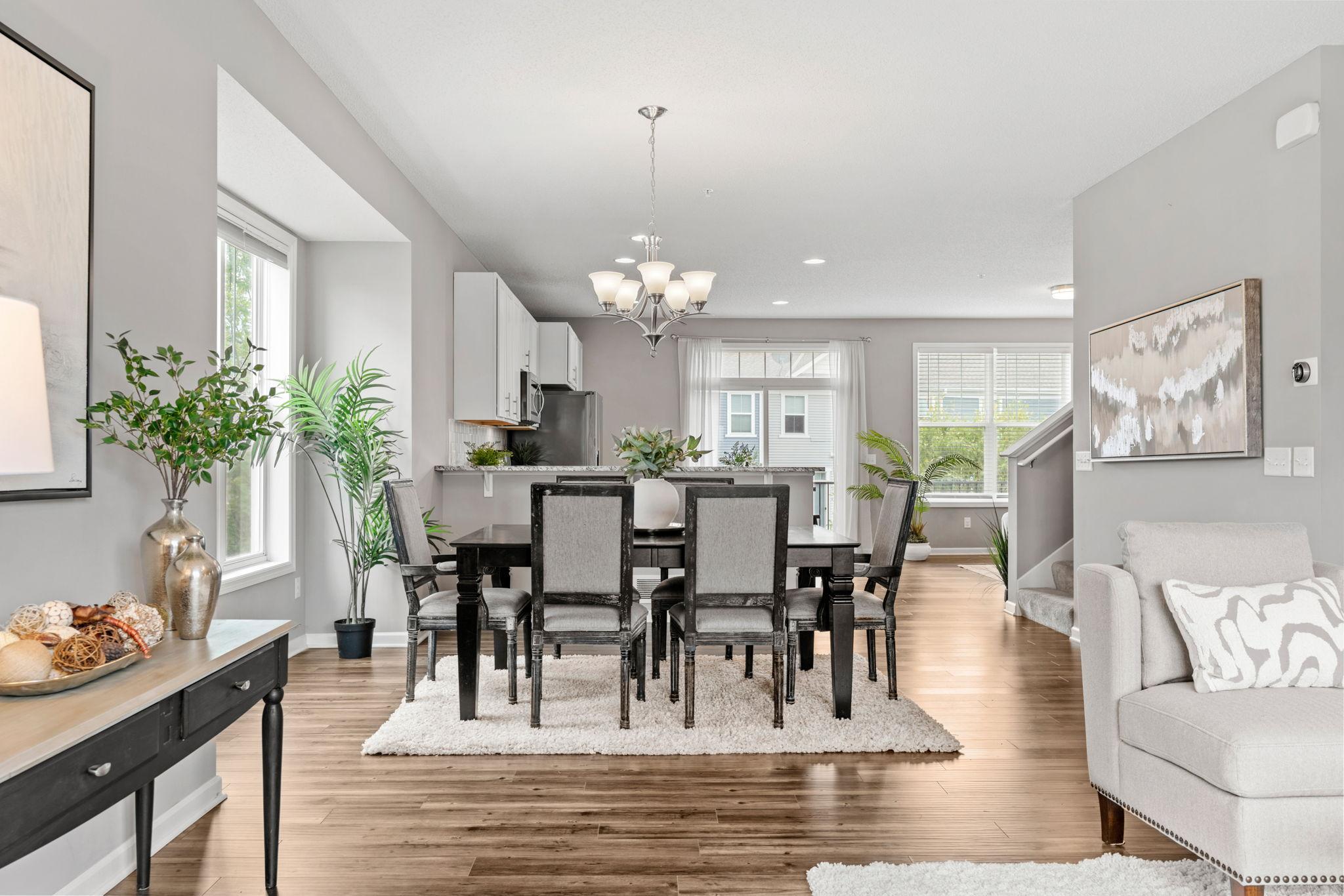 The entire main level features the LVP hardwood floors and lots of windows and 9ft ceilings