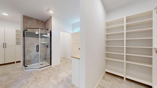 Primary Bath w/ His and Hers Closets
