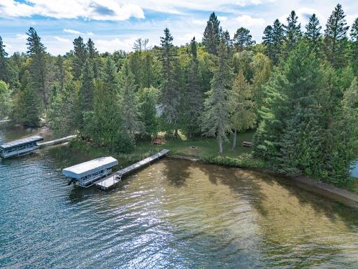 Hard-to-find lakeshore with hard sand bottom AND level lot! Plus on Thunder Lake!