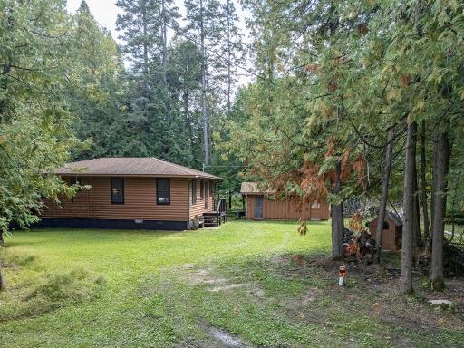 Enter the property from Jitterbug (a private road). Here you see the cabin and the building that holds a sauna and a bath. Now going inside...