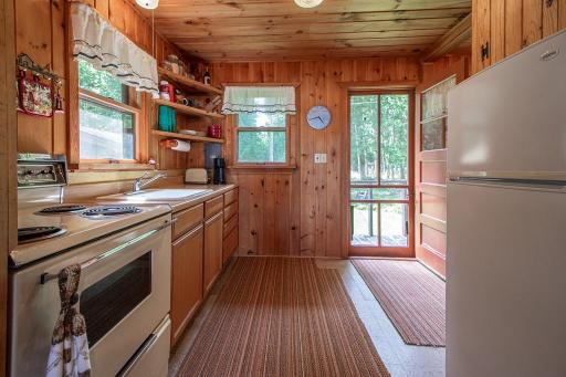 Looking back through the kitchen to the entry door.