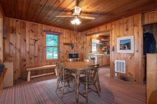 Dining area sits between kitchen and living area.