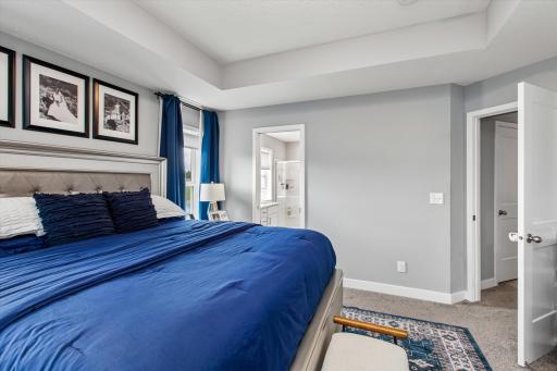 Primary en-suite with bathroom and walk-in closet
