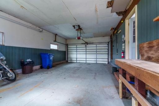 Oversized two-stall garage with workbench, automatic door opener, and side window