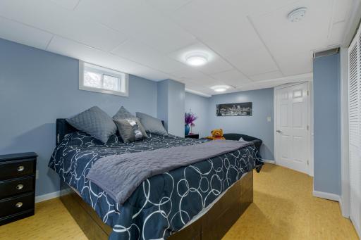 Lower level bedroom with space for a king-size bed and additional furniture
