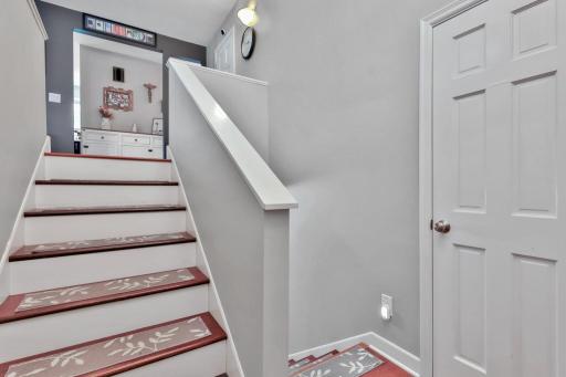 Front entry with closet and door to garage.